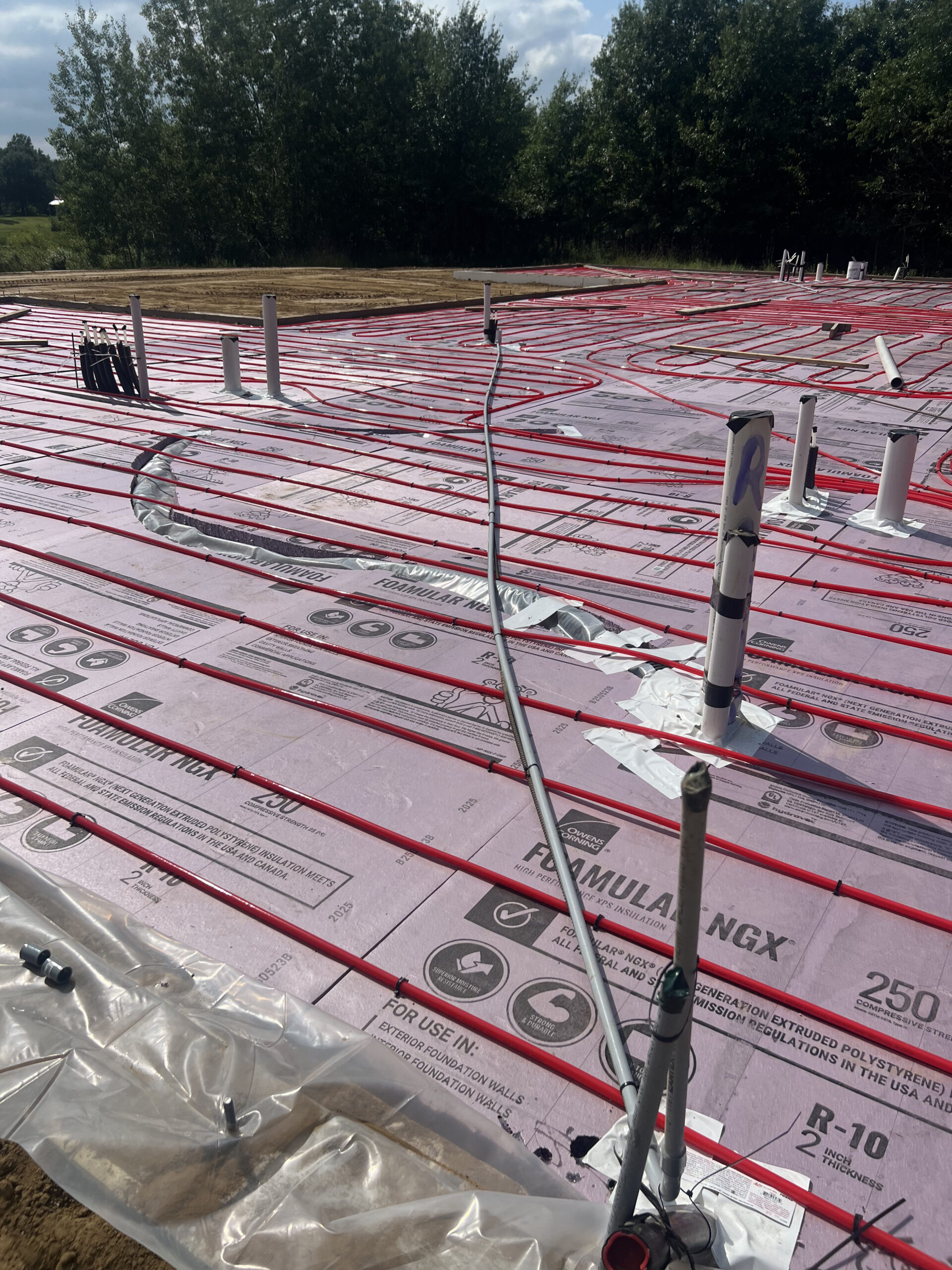 Radiant floor heating tubes on insulated foundation base