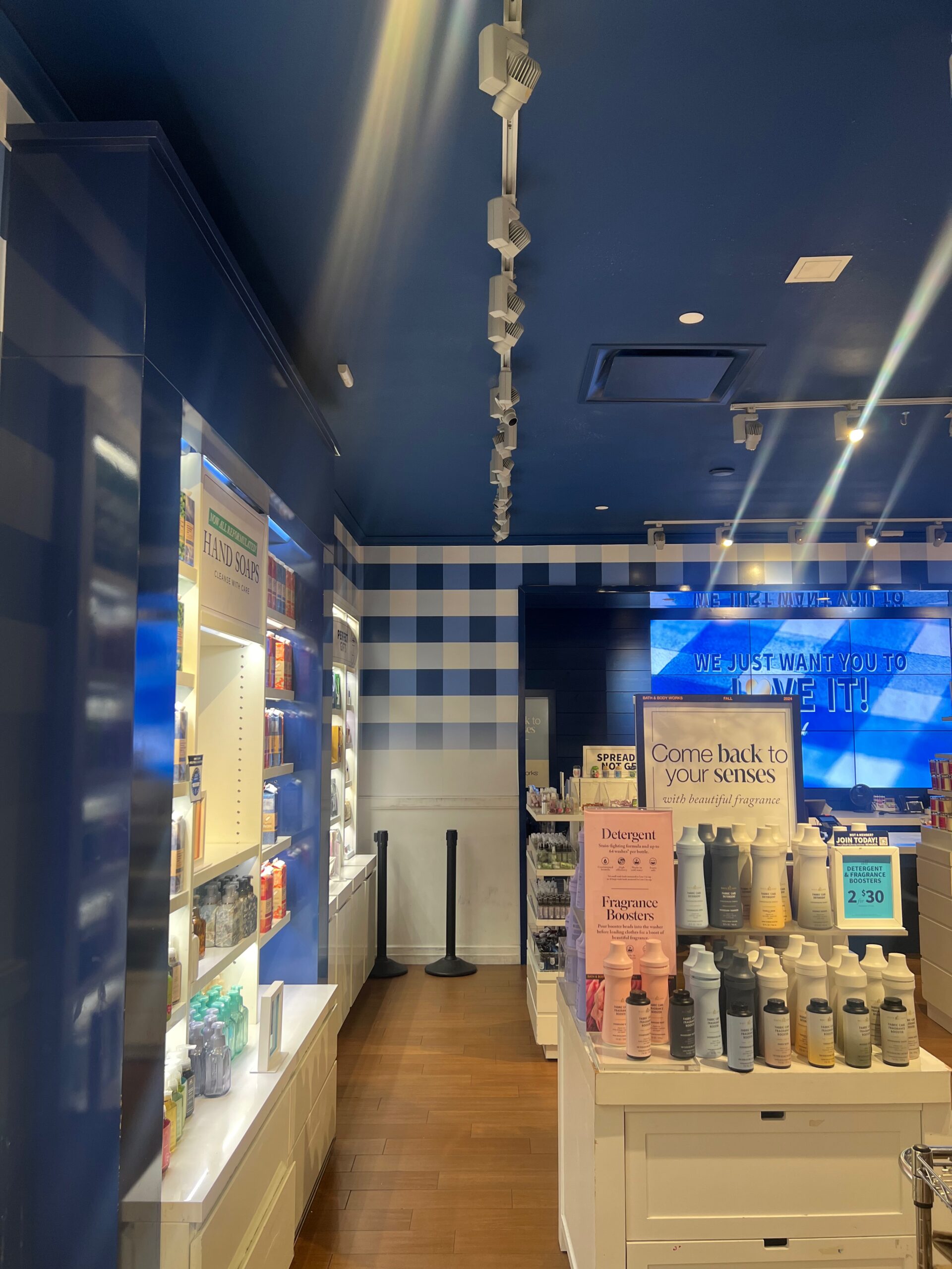 Bright retail store with soaps and fragrance displays